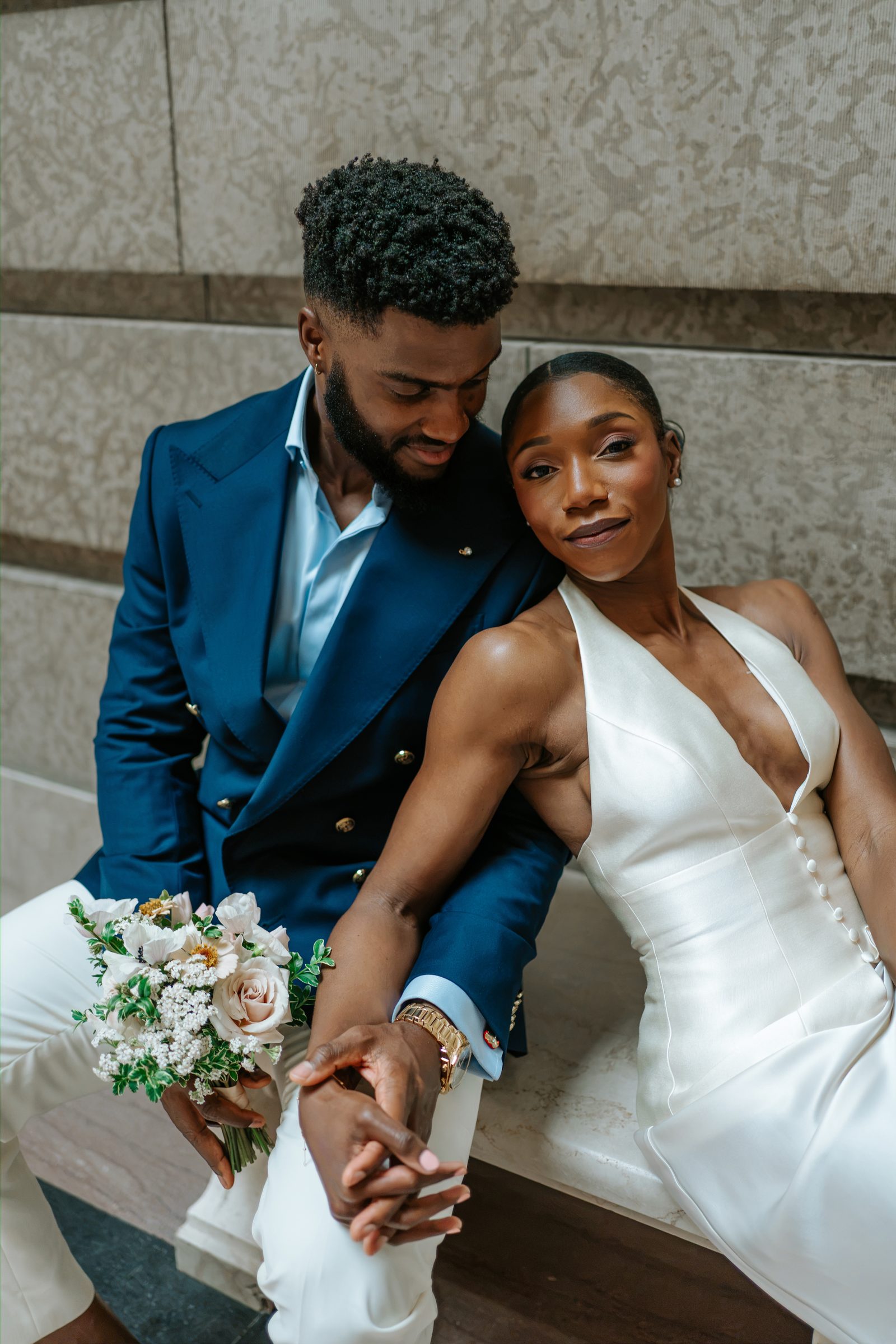 Tobi and Emeka couple portrait inside the Manitoba Legislative Building — rotunda staircase in background, Winnipeg wedding photography