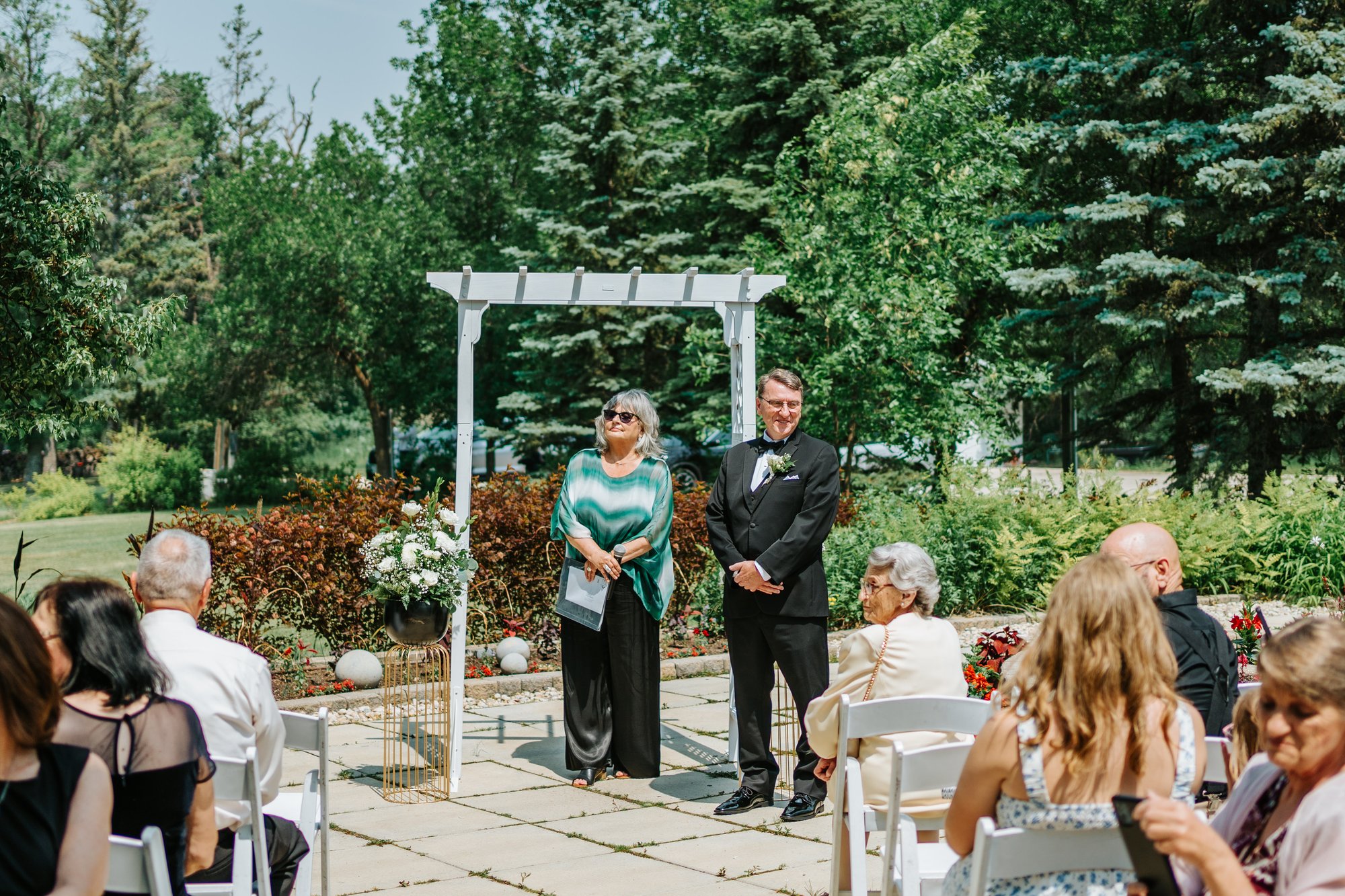 Vicki and Rene during ceremony at The Gates on Roblin Headingley — wedding photography by Ngo Photography
