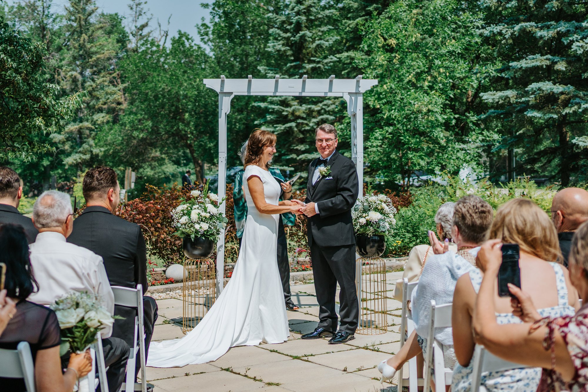 Intimate wedding ceremony The Gates on Roblin Manitoba — photography by Chris Ngo