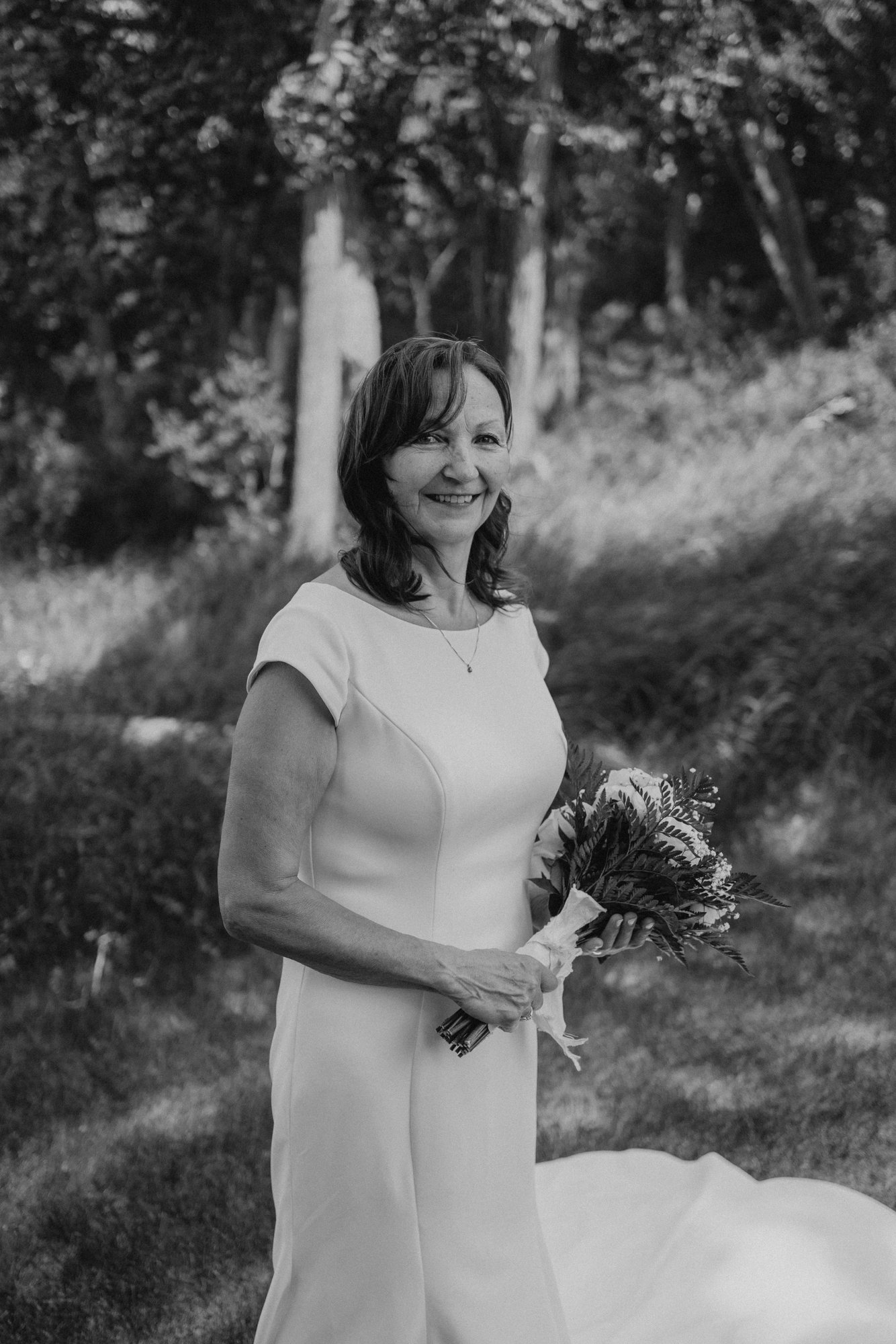 Couple portrait on the Assiniboine River grounds at The Gates on Roblin — Ngo Photography