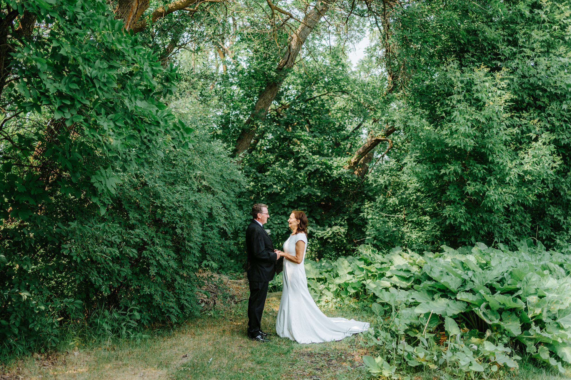 Couple walking the grounds at The Gates on Roblin — wedding photography by Ngo Photography