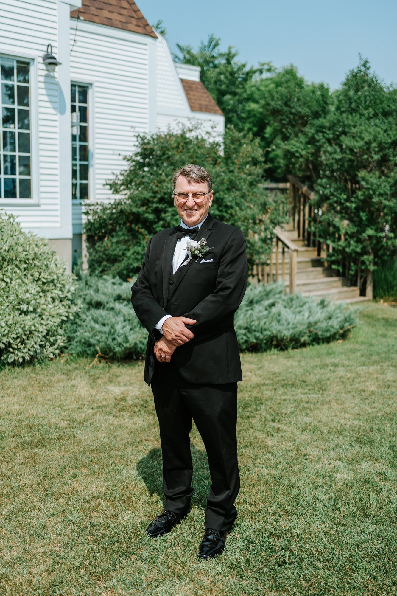 Outdoor couple portrait at The Gates on Roblin Manitoba — photography by Chris Ngo